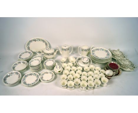 An extensive Wedgwood dinner service, in the 'Angela' pattern, including cups and saucers, coffee pots, plates, bowls, a teap