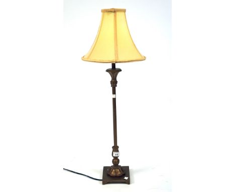 A contemporary table lamp, the gilt metal frame supported on a square base, height (excluding the shade) 69cm