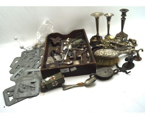 A selection of assorted metalware, to include silver backed hairbrush, silver spill vase, a nutcracker and more