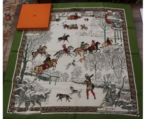 A boxed Hermes Paris silk scarf depicting historical hunting scene with village in the background and children playing in the