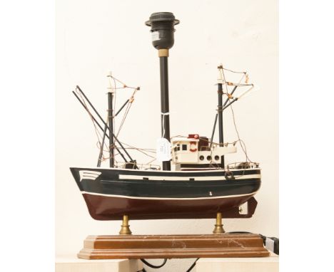 A wooden lamp in the form of a ship.