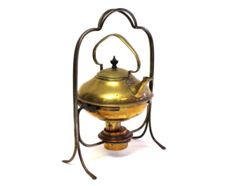 William Soutter and Sons, an Arts and Crafts brass spirit kettle on a stand, circa 1900, the handle in the form of a stylised