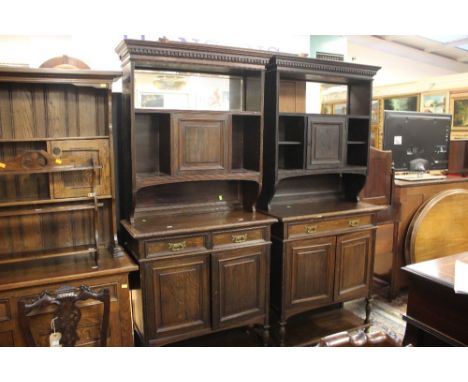 A Late Victorian oak chiffonier, fitted with a mirrored back to upper section, with a single door below, the base section wit