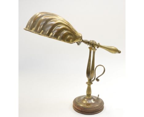 A brass table lamp, modelled in the form of a shell