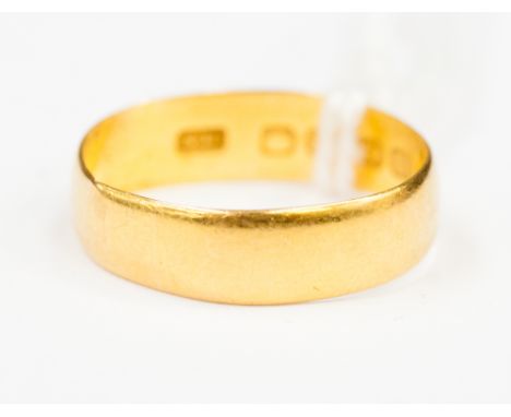 A 22ct yellow gold plain wedding ring weighing 2.5 grams
