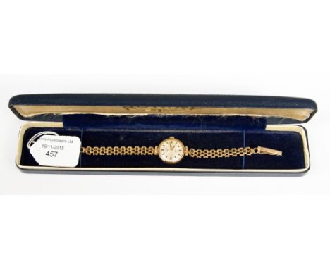 A ladies Rotary 9ct gold cased wristwatch, with baton numerals to the circular dial and having 9ct link bracelet, with extra 