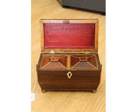 A rosewood tea caddy being inlaid with satinwood and having Ivory escutcheon 