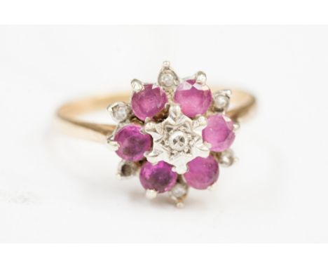 An 18ct gold ruby and diamond cluster ring.