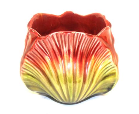 Christopher Dresser for Ault, a majolica jardiniere, circa 1880, of scallop leaf design, glazed in red draining to green, imp