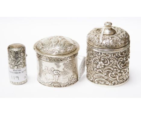 A Walker and Hall gilt lined and embossed silver lidded trinket pot, with a Continental lidded silver trinket pot, (having im