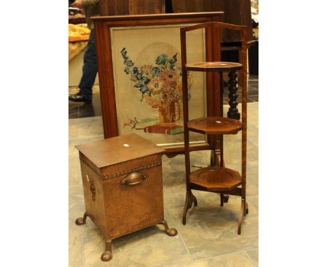 An Arts & Crafts style copper coal box, together with a walnut fire screen and an oak three tier cake stand.