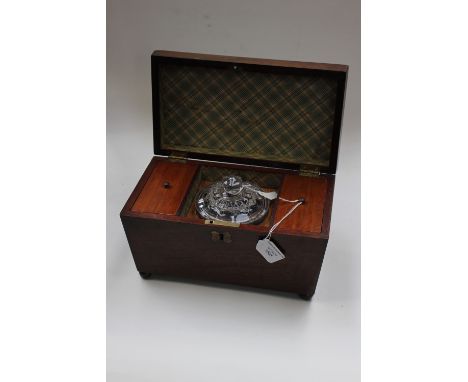 A George III mahogany tea caddy, complete with a fitted interior 