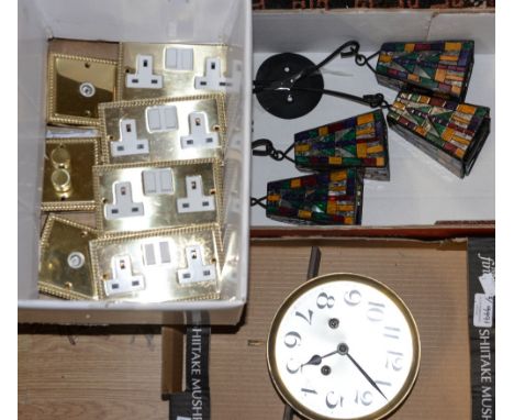 A collection of brass light switches, dimmers, etc; together with a clock mechanism and hanging light fittings 