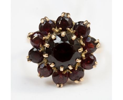 A garnet cluster ring on 9ct gold band 