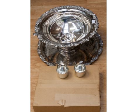 A heavy gauge silver plated punch bowl, fruiting vine decoration, 45 cm diameter approx, with matching silver plated tray, 50