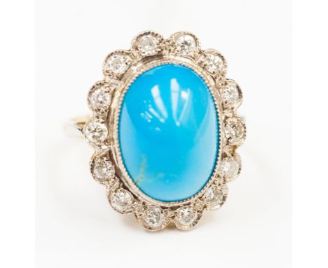 A turquoise and diamond oval cluster ring, the oval cabochon cut blue turquoise approx 14mm x 10mm, a surround of 14 round br