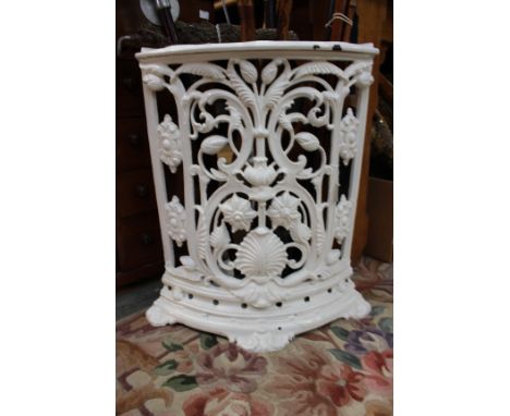 A white painted cast iron corner stick stand