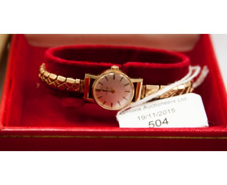 A 9 carat gold ladies Omega wristwatch, in original box, manual wind, on plated bracelet strap.