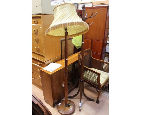 A 1960s oak standard lamp, fitted with a cream shade, together with a coat stand, (2)
