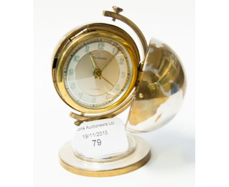 A 1940s Art Deco brass and silver plated travelling alarm clock, with a 17 jewel movement, raised on a stepped base 