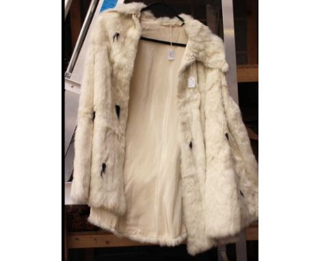 A white ermine fur cloak 