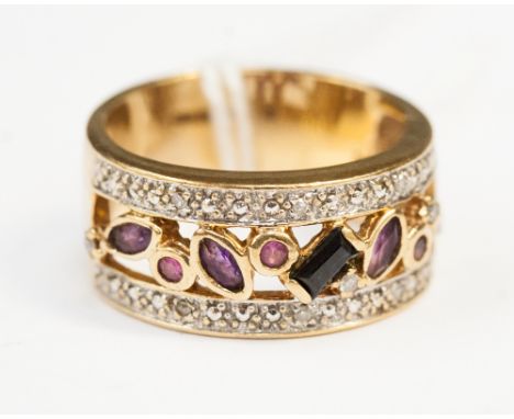 A 9ct dress ring, with two rows of diamonds and set amethyst, sapphire and ruby to the central openwork mount, approximately 