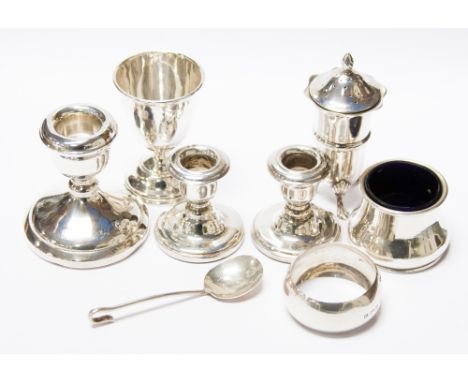 A mixed lot comprising 1977 Jubilee candlestick, a pair of small candlesticks 1980's, pepper pot, London 1905 and an egg cup.