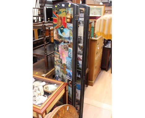 A four fold screen, each panel decorated to each side with a photographic montage