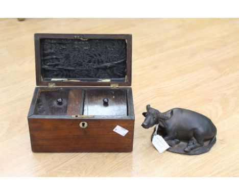 A recumbent Bison figure signed Vasaron 1936; along with a Victorian tea caddy (af) (2) 