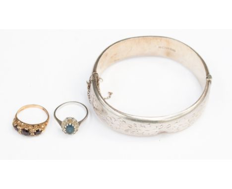 Silver bangle and silver ring, together with a 9ct gold garnet ring. (3)