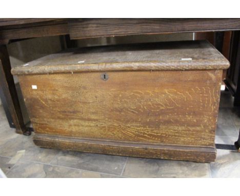 A 19th Century lidded trunk.