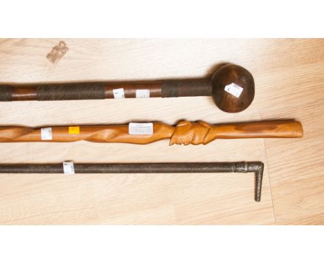 A Indonesian clubbing stick, walking stick and riding crop 