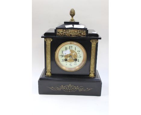 A Victorian French black slate clock with pineapple finial gold trim 