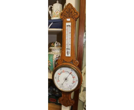An oak barometer with thermometer c.1900