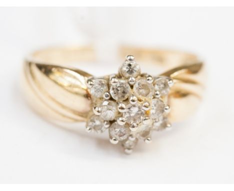 A 14ct gold diamond cluster ring.