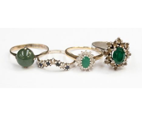 Four various dress rings, comprising a 9ct gold emerald and diamond cluster ring, ring size 'L', a silver sapphire and white 