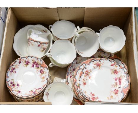 A Victorian twelve piece part tea service including cups, saucers, slop bowl, milk jug and two cake plates (12)