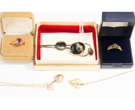 A 9ct gold leaf pendant set pearl, a 9ct heart shaped locket on a fine link chain with St Christopher, a 9ct ring set amethys