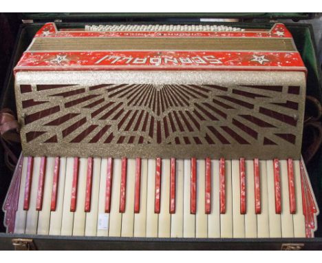 A piano accordion, maker Scandalli in case.