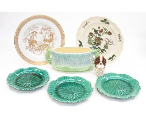 A Beswick begging dog holding a bowl, imprint to base, 1054, with three Wedgwood Majolica plates and a Sylvac Squirrel handle