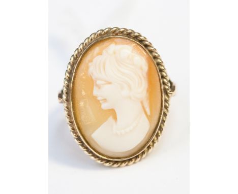 A large cameo, framed into a 9ct gold ring 
