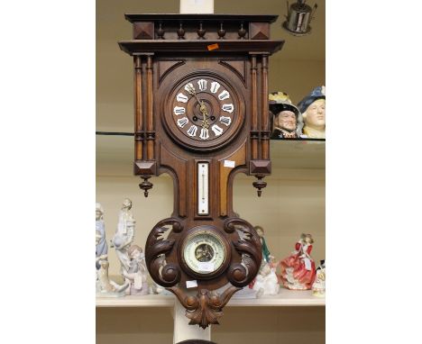 A late 19th Century French mahogany wall clock with barometer gallery top 