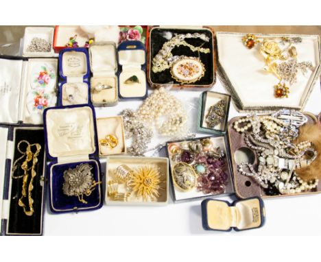 A quantity of costume jewellery including simulated pearls, earrings, two Royal Worcester floral plaques, etc.