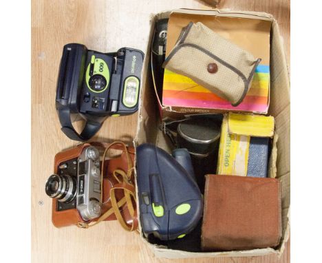 A box of Polaroid and other camers