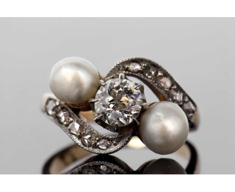 Diamond and pearl crossover ring featuring a round old cut diamond 0.30ct approx, and two pearls set between diamond set shou