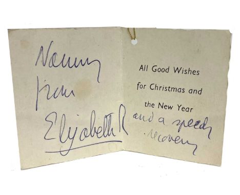 A Christmas gift greetings card signed by Quen Elizabeth II and inscribed "Nanny from Elizabeth R and a speedy recovery) Prov