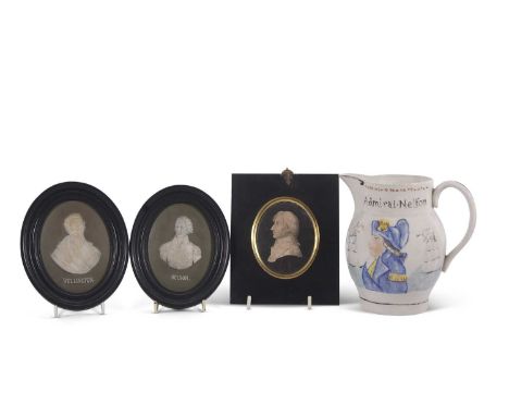 A Prattware type jug with images of Lord Nelson and Captain Hardy together with Wedgwood portrait medallions of Nelson and We