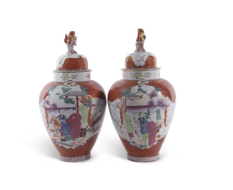A rare and impressive pair of 19th century Herend vases painted in chinoiserie style with Chinese figures the covers with foo
