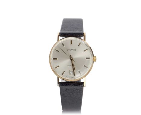 A yellow metal Garrard automatic gents wristwatch with box and certificate of guarantee from 1985, the watch has an automatic