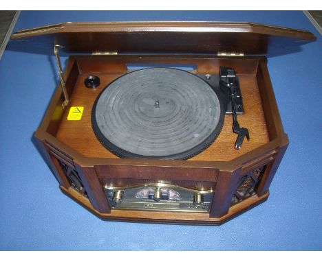 Antique style record player with CD, three speed turn table, cassette player and FN receiver